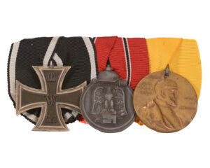 WWI and WWII combat veteran's 3 medal set mounted on ribbon bar -Iron Cross 2nd Class (EKII), Centenary Medal, Eastern Front Medal (Winterschlacht im Osten 1941/42)