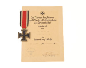 German WWII 1939 Iron Cross 2nd Class (Eisernes Kreuz II. Klasse) with its original award document and ribbon